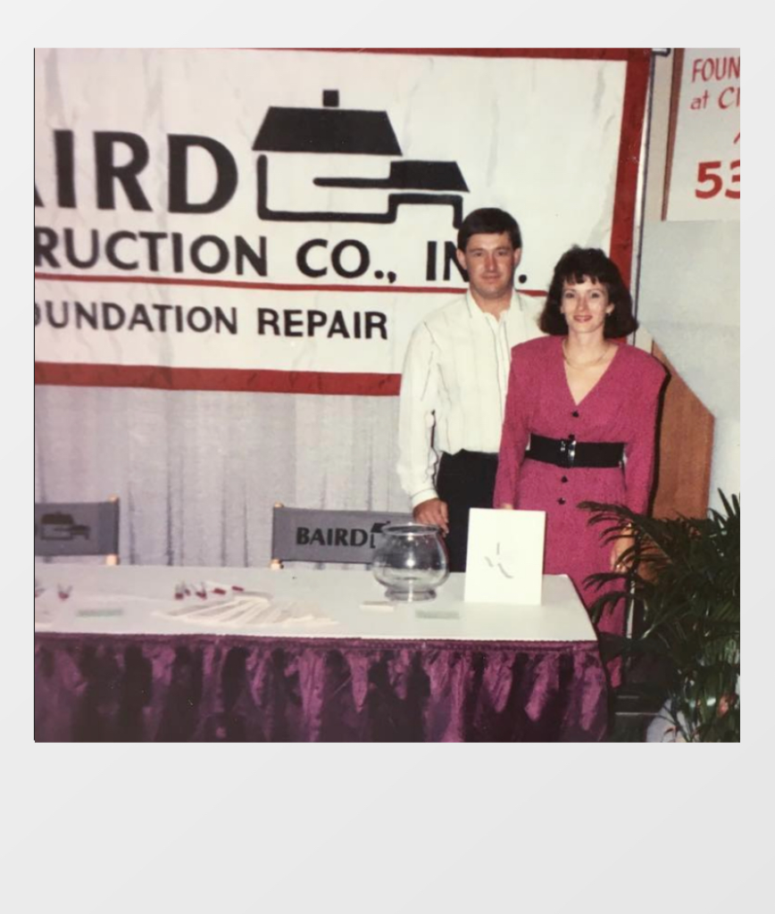 old picture of Baird foundation repair owners smiling for the camera