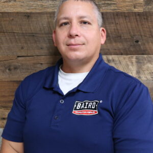 Headshot of foreman, Francisco Mercado, taken at the San Antonio office. He is wearing a navy Baird polo shirt.