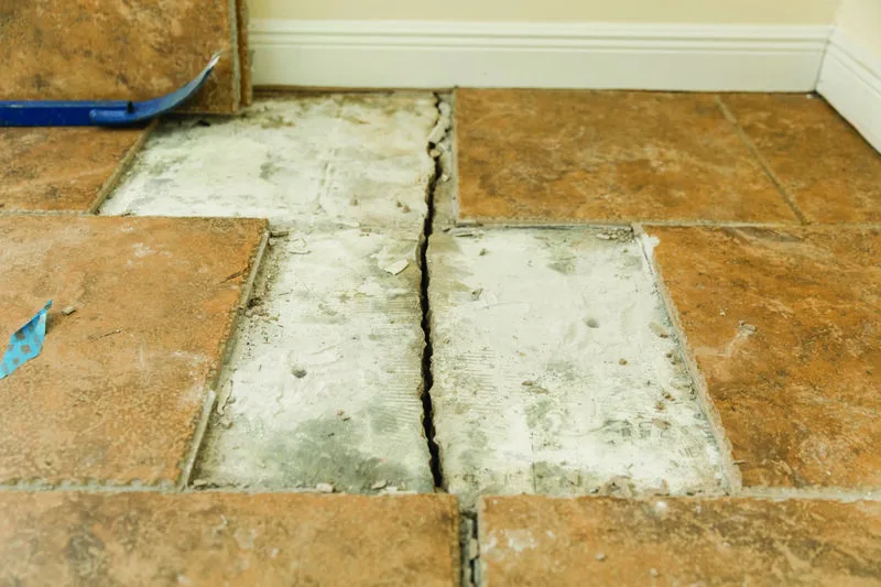 View of cracked tile floors which require foundation repair.
