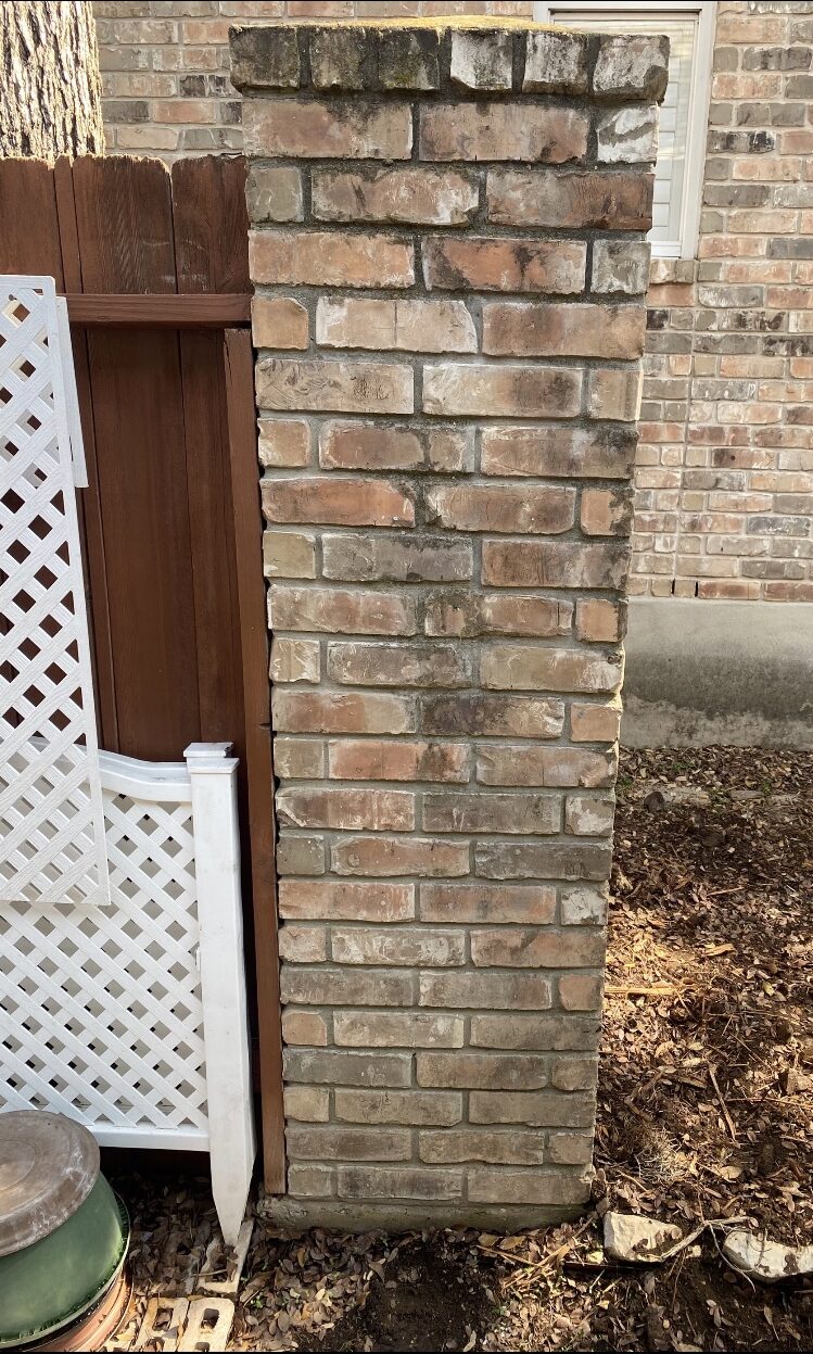 brick fence pillar outside a home leveled and standing up straight