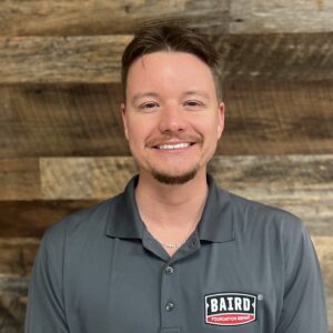 Houston System Design Specialist smiles for headshot