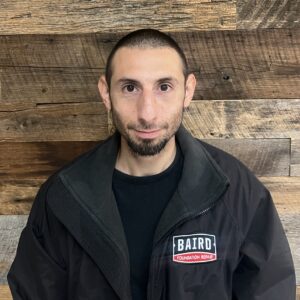 San Antonio installer smiles for his headshot at Baird's office