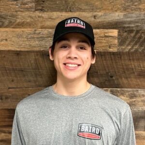 Structural installer smiles for headshot at Baird office