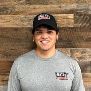 Structural installer smiles for headshot at Baird office
