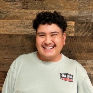Structural installer smiles for headshot at Baird office