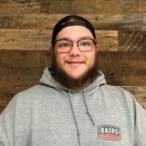 Structural installer smiles for headshot at Baird office