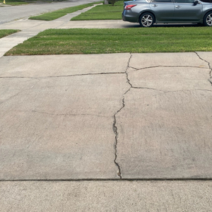 driveway showing surface cracking.