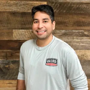 Houston Warehouse Assistant smiles for his headshot