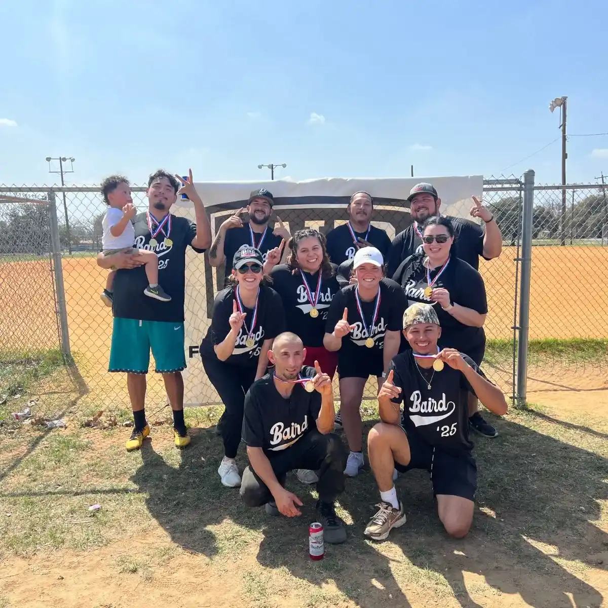Kickball team smiling after winning tournament