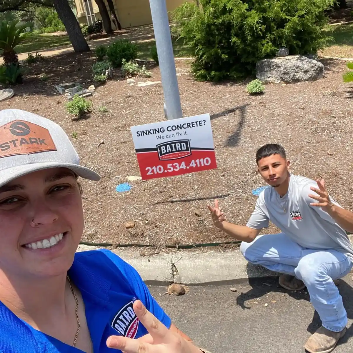 Concrete Crew Smile with a Yard Sign