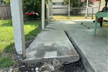Back patio showing signs of soil wash out