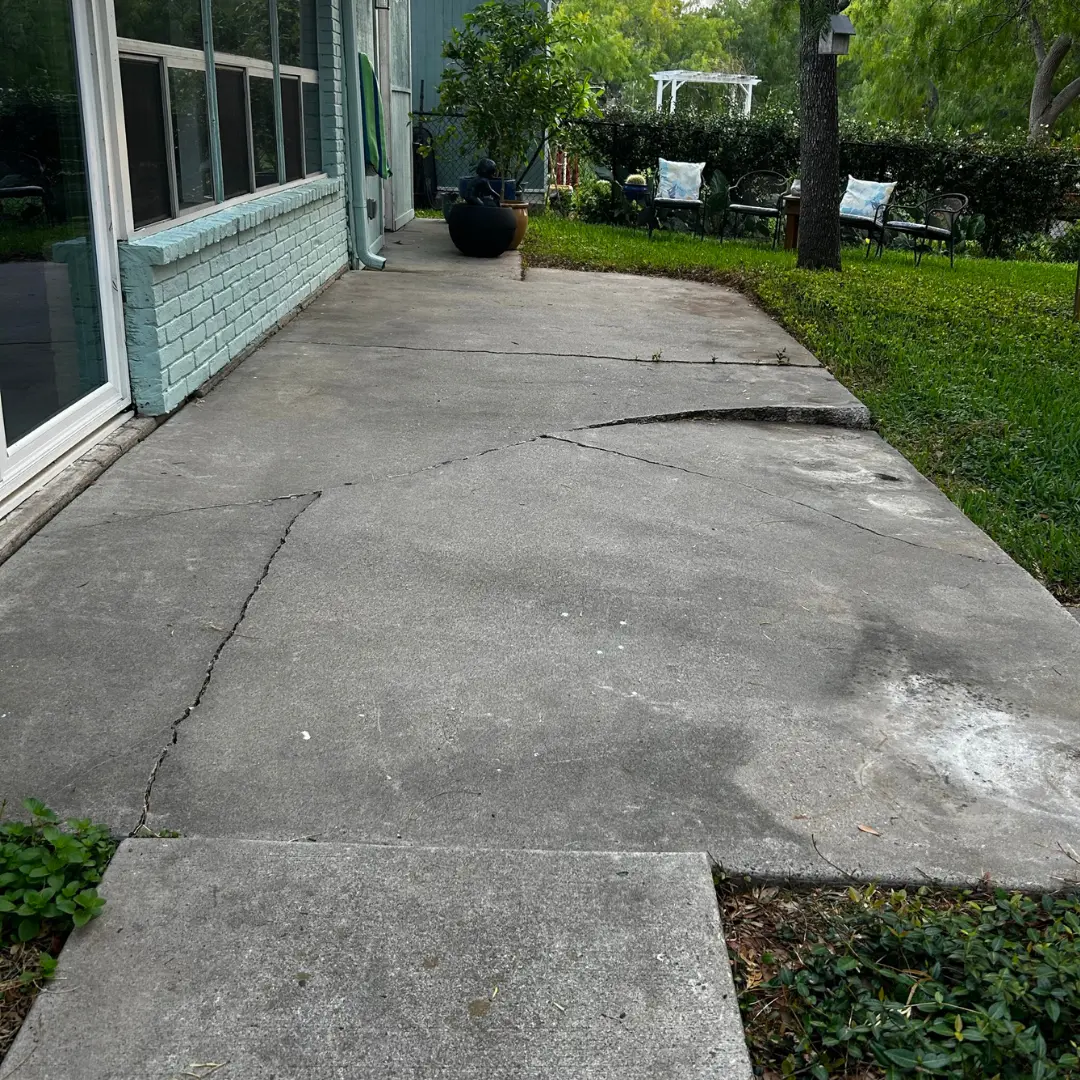 Customers back patio sinking and cracking due to voids underneath.
