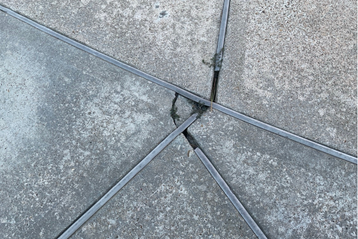 Sugarland customer concrete with open controlled joints.