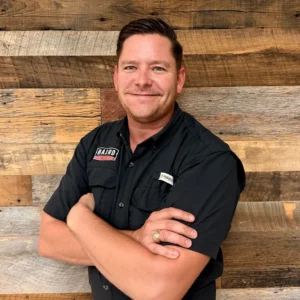 Austin System Design Specialist Wade Hill smiles for his headshot.