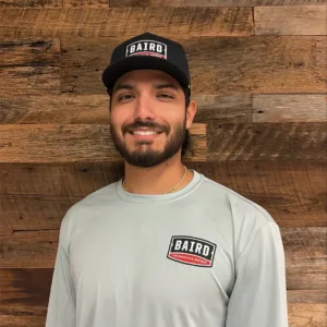 Justin Silos San Antonio Concrete Co- Foreman smiles for his headshot at the San Antonio Office.