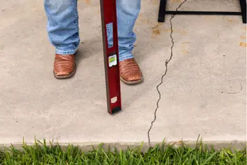Baird Foundation Repair System Design Specialist looking at a customers concrete during an inspection