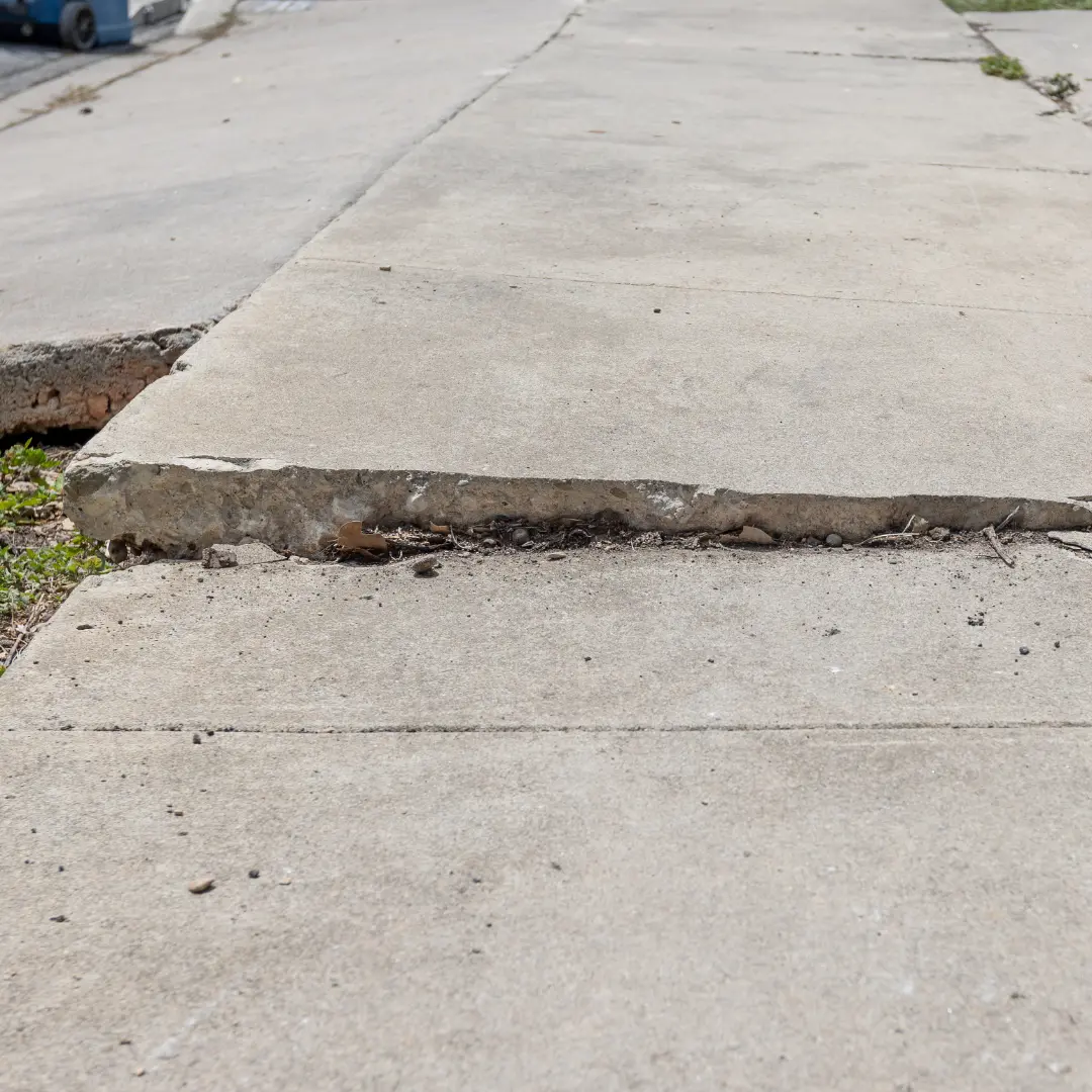 A section of concrete sits lower than another, it could indicate that the soil beneath the slab has shifted or washed away.