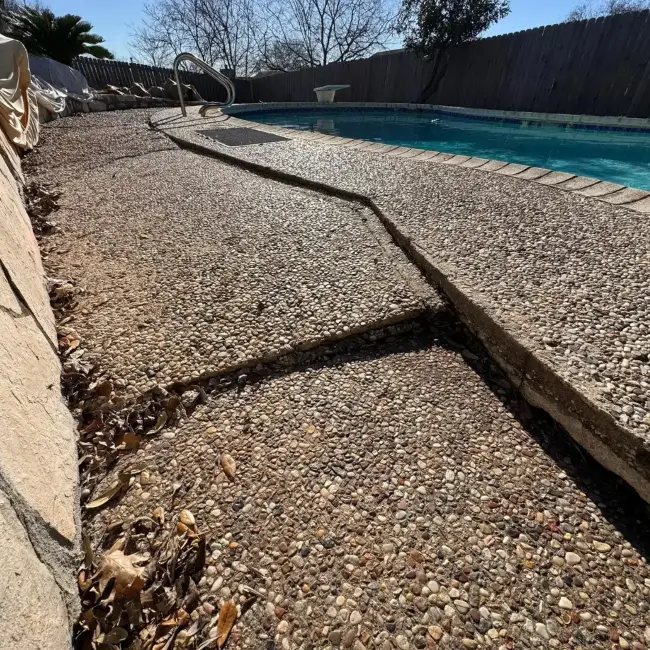 The customers' pool deck is sinking due to voids underneath.