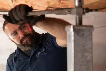 Baird Foundation Repair foreman installing SmartJack System.