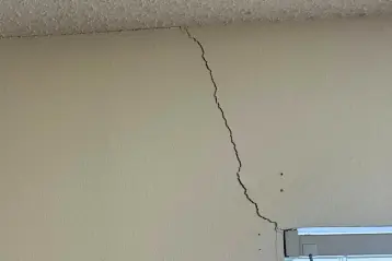 Customers home in San Antonio Texas with cracks along the window, showing signs of foundation settlement before foundation repair